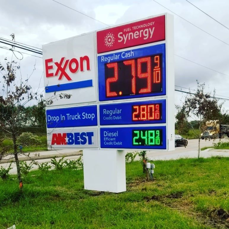 A sign for a gas station that says exxon on it