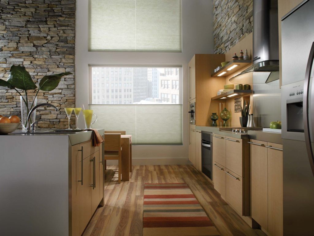 A kitchen with stainless steel appliances and wooden cabinets