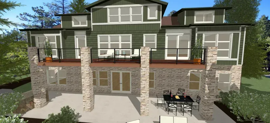 Two-story gray house with stone pillars, balconies, and a patio with outdoor furniture.