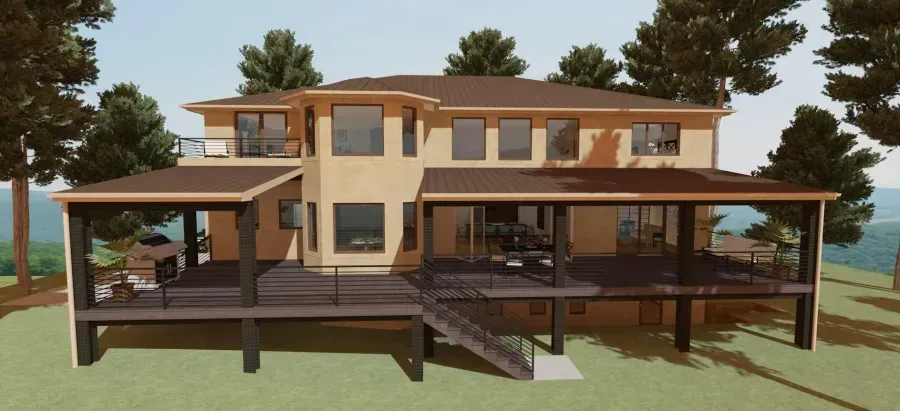 Modern two-story house with beige walls, wood accents, and broad front and side decks in a wooded setting
