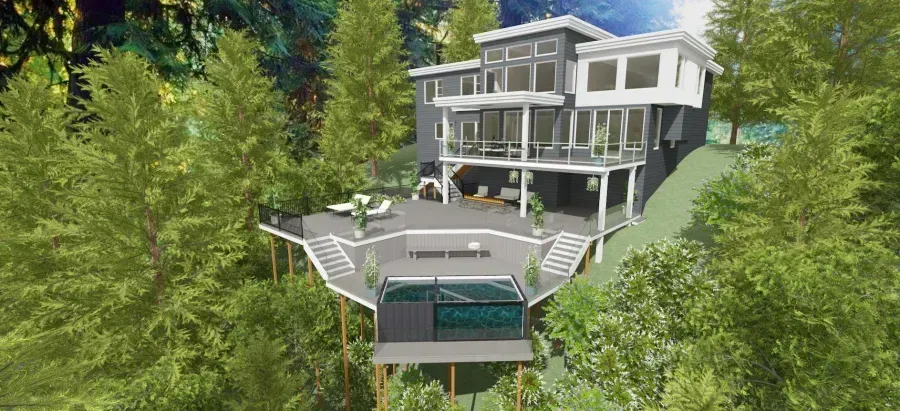 Modern house on a wooded hillside with a tennis court and large deck overlooking the forest