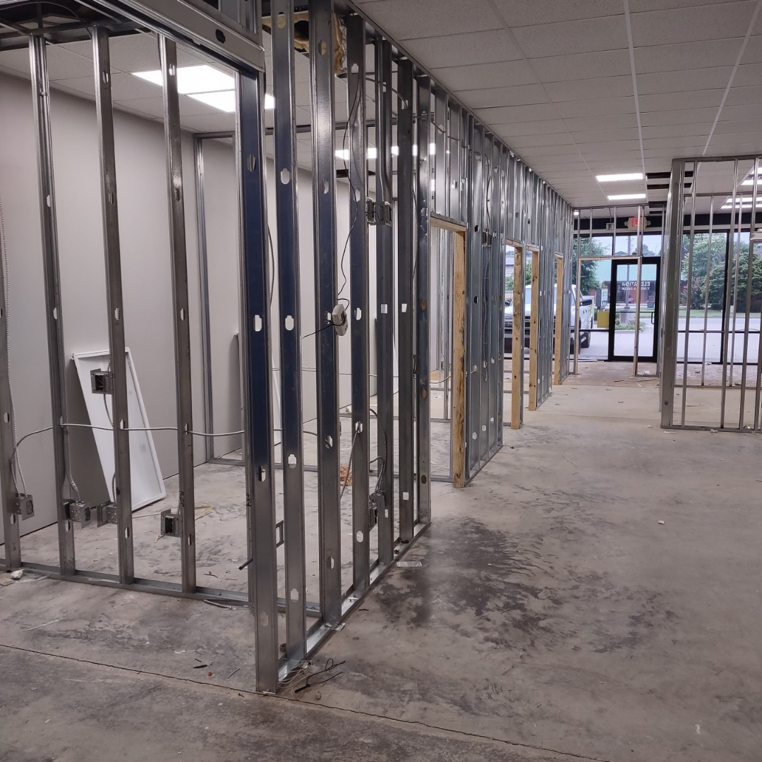 Blue and green epoxy floor, glossy finish in an industrial setting.