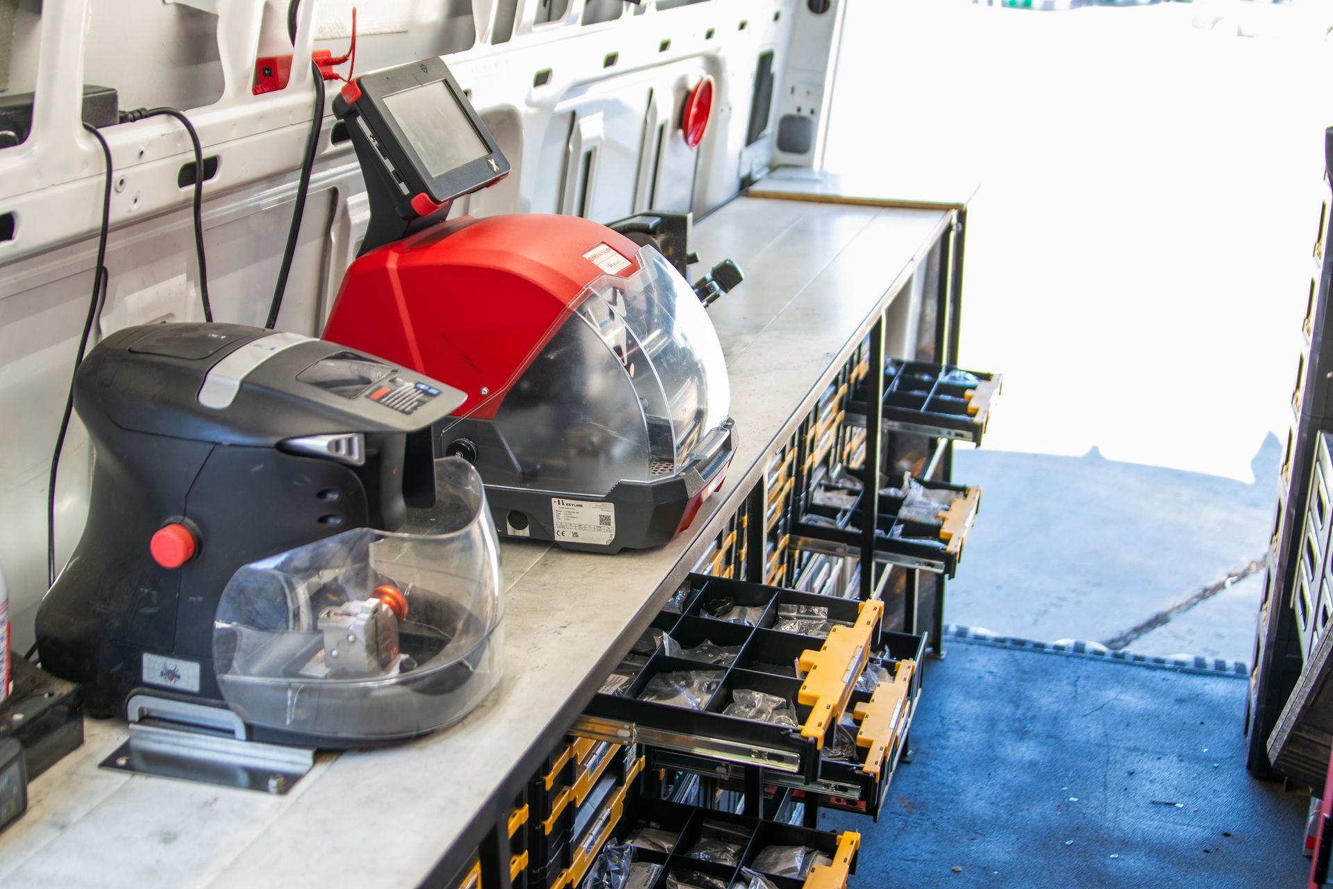 A bunch of tools are sitting on a table in a van.