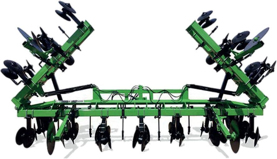 A green tractor with a bunch of blades on it