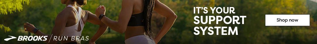 Two women standing outside in front of foliage. Text reads: 