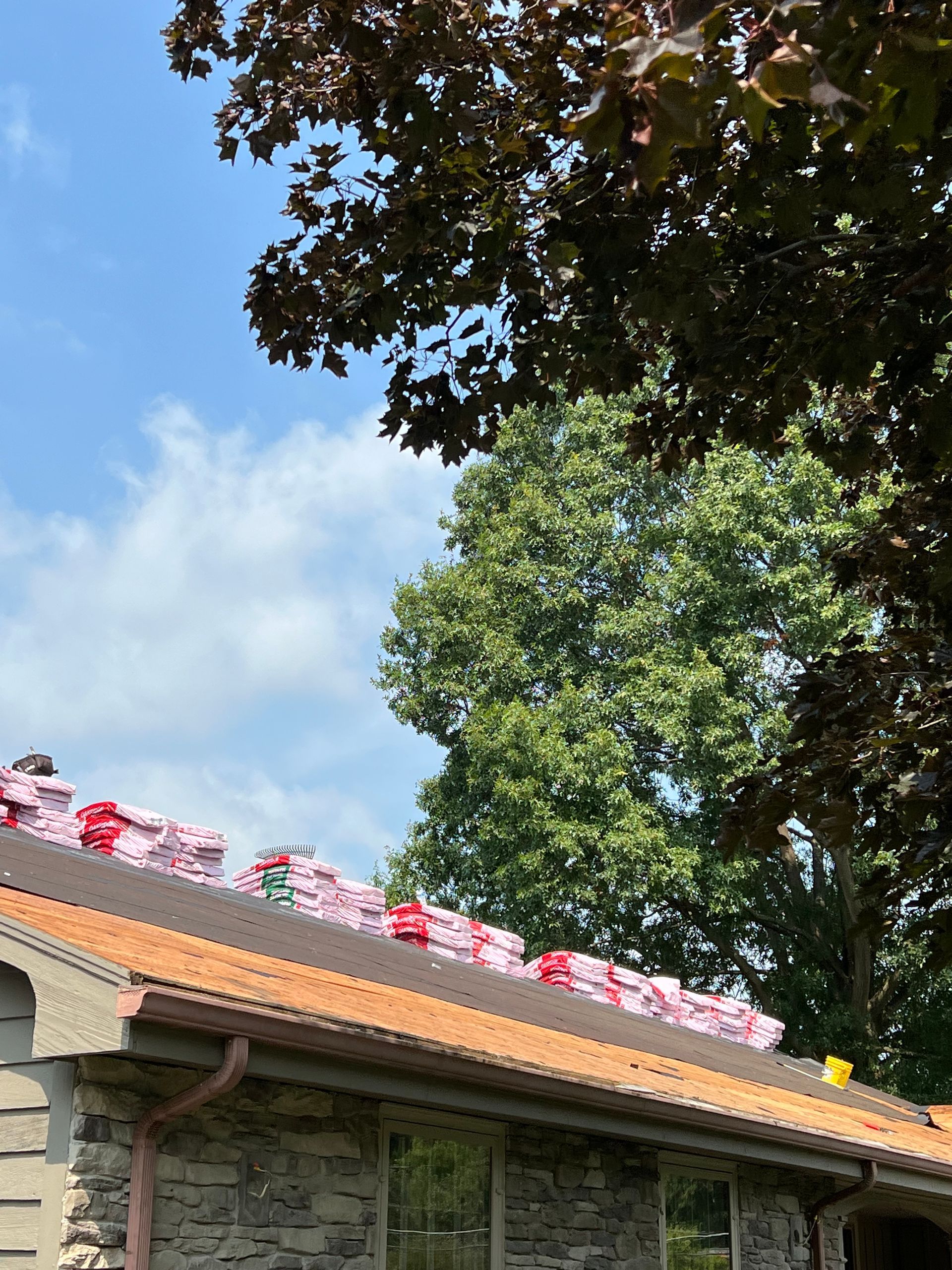 A house with a roof that has a lot of shingles on it