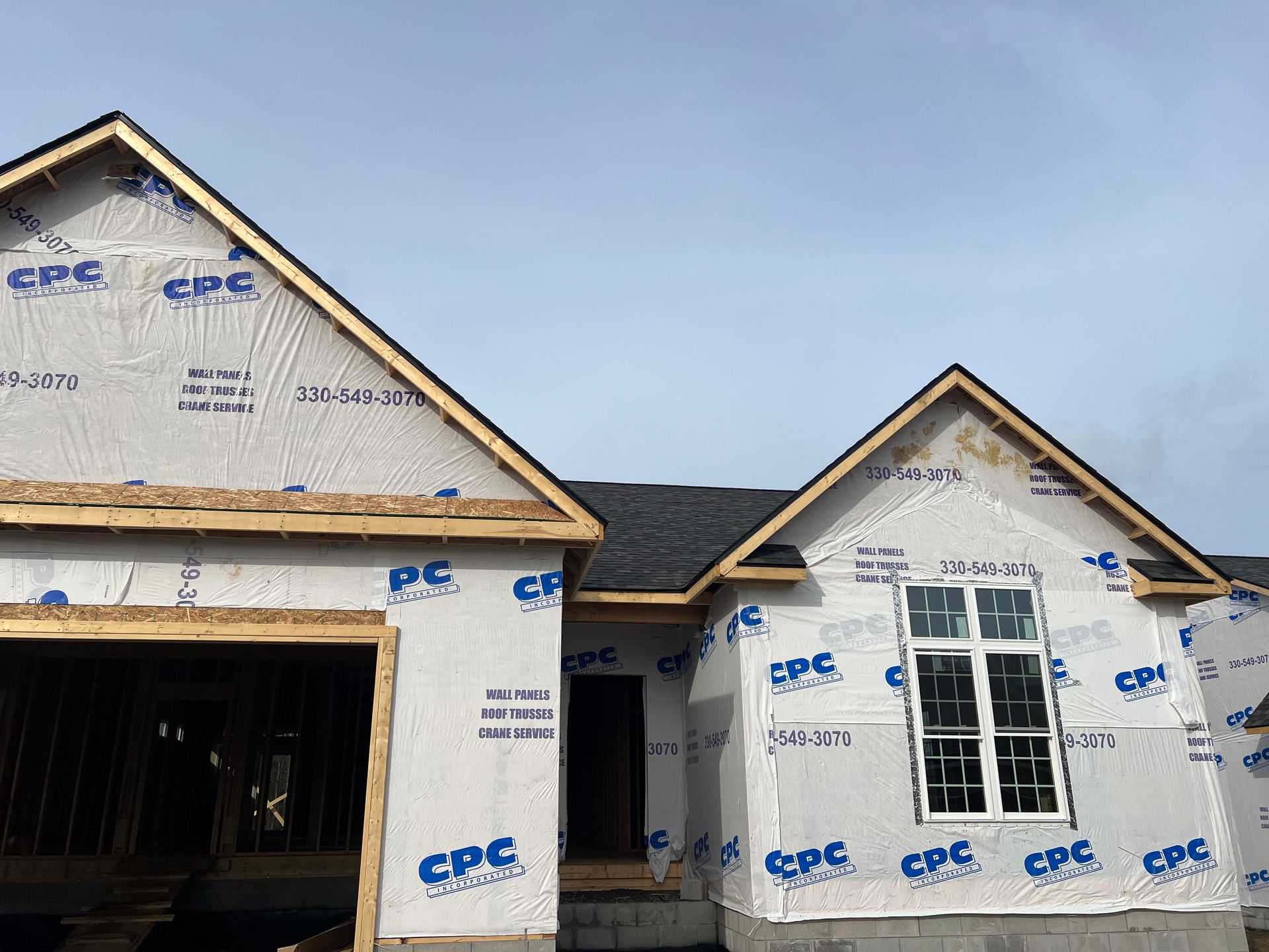 A house is being built with a lot of insulation on it.