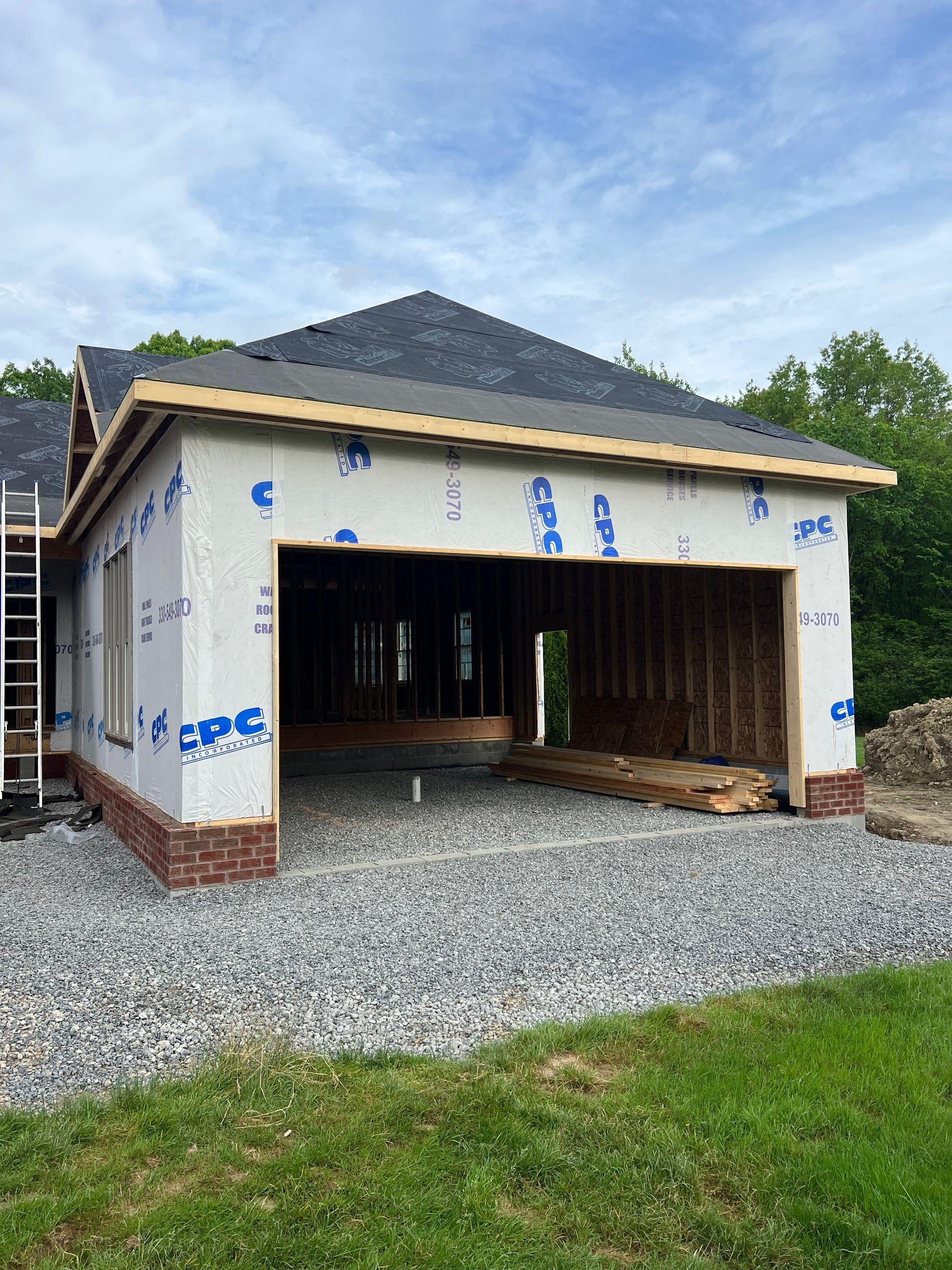 A house is being built with a garage underneath it.