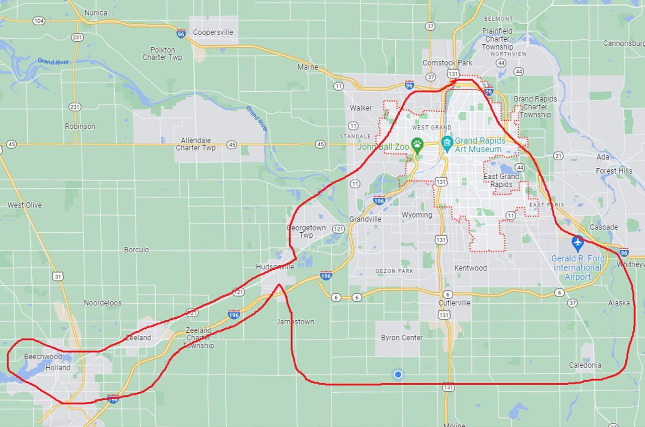 Map showing a red route outlining a journey through a city and surrounding areas.