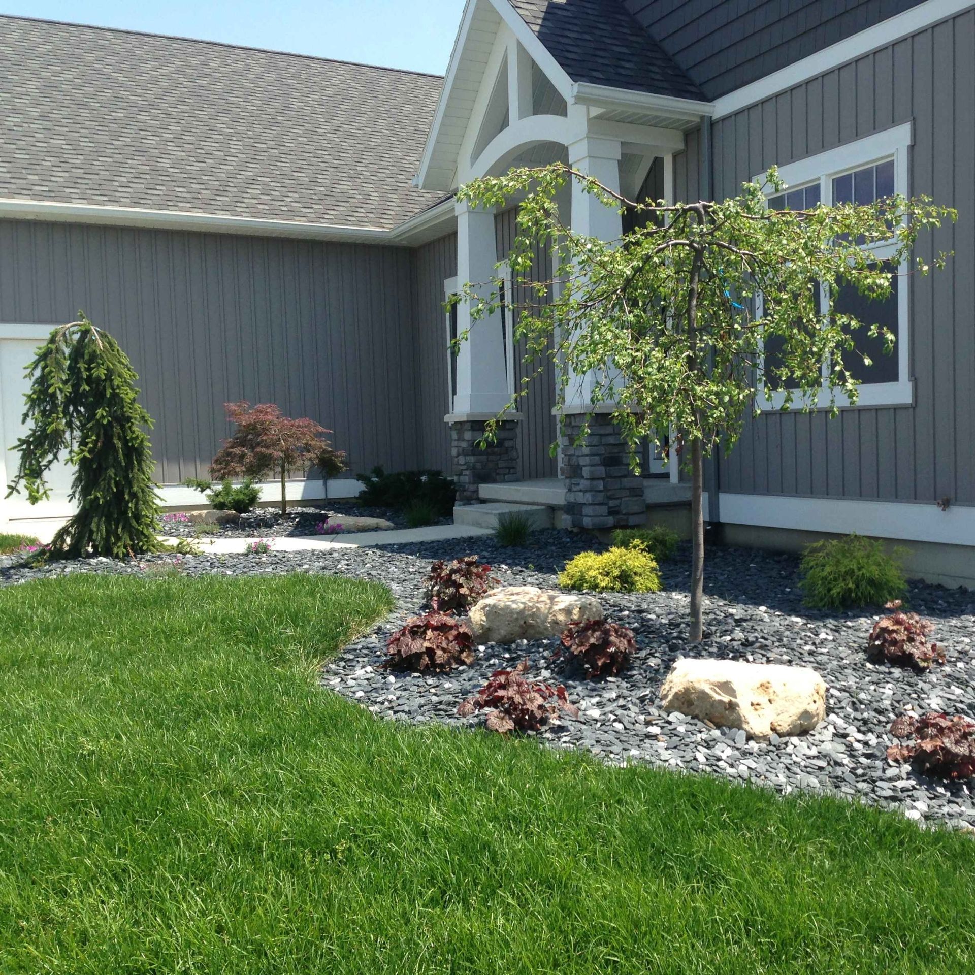 A house with a lot of rocks in front of it