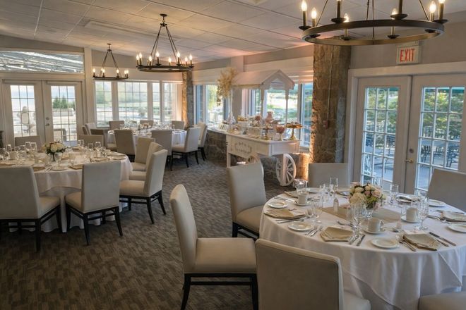 Elegant dining room with round tables, white linens, and chandeliers.
