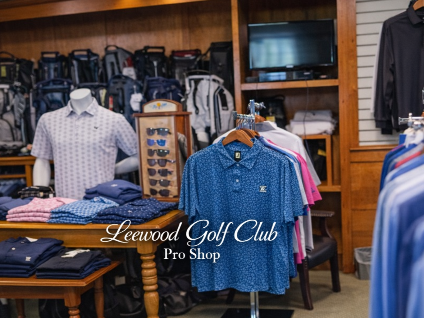 Golf club pro shop with shirts on mannequins and clothing racks in a wood-paneled store