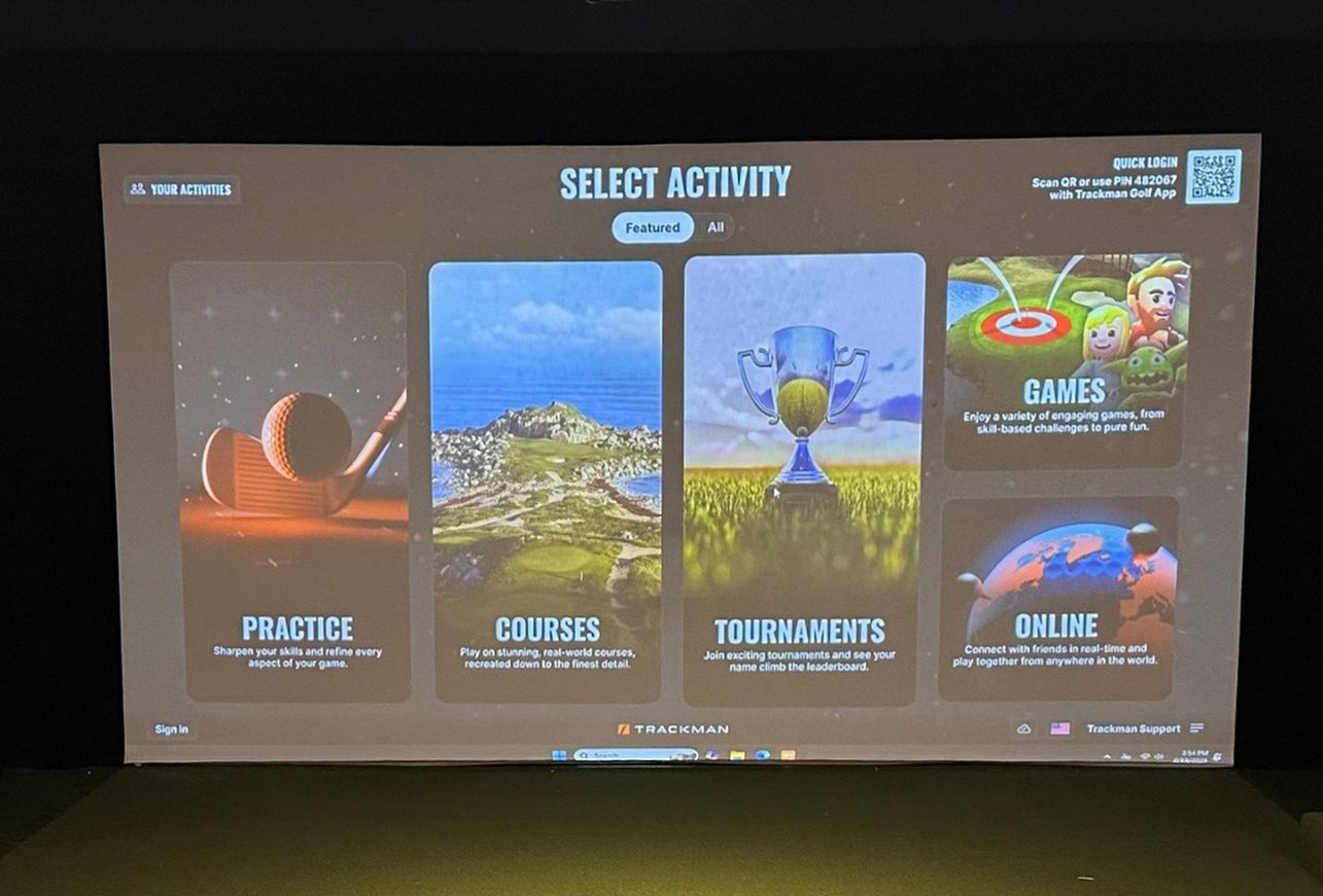 Golf simulator activity selection screen showing Practice, Courses, Tournaments, Games, and Online options.