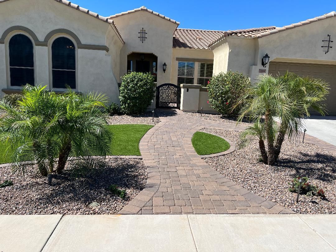 A house with a brick walkway leading to it
