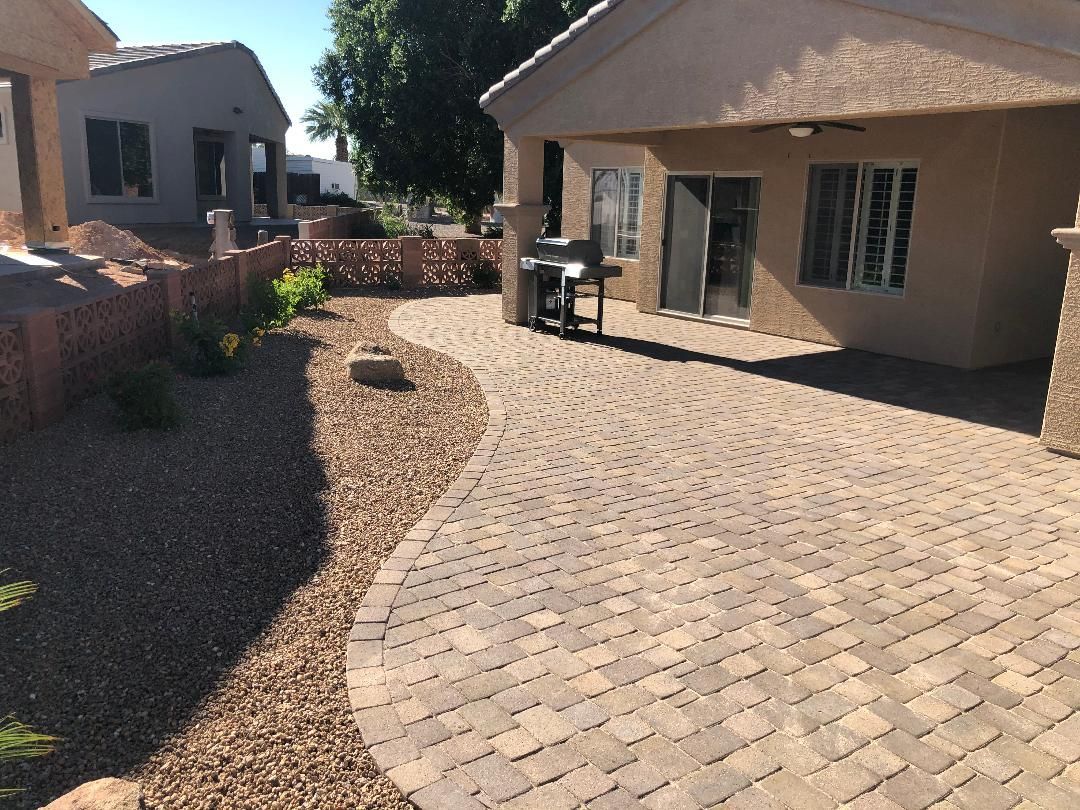 A house with a brick driveway leading to it