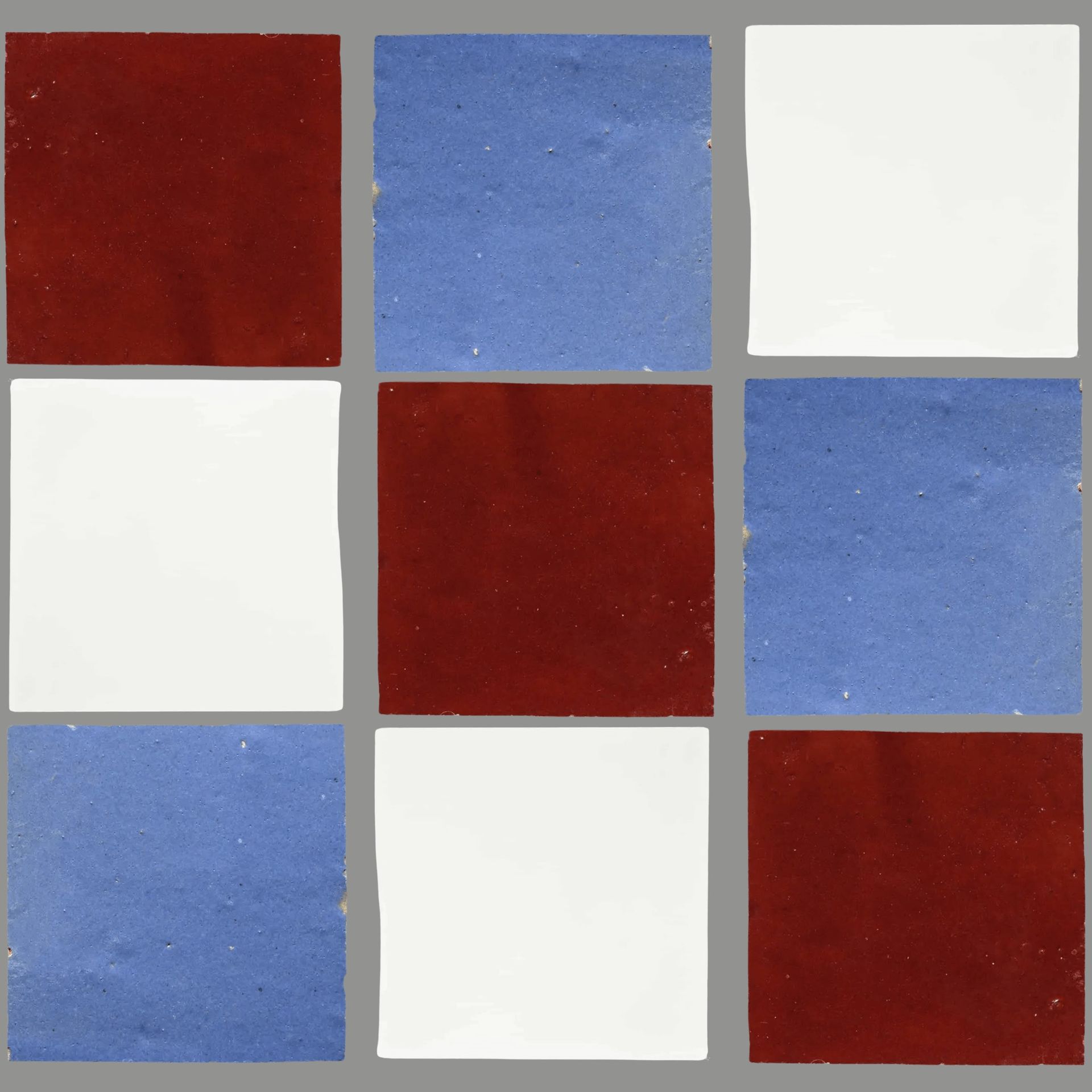 Nine square tiles arranged in a 3x3 grid, in alternating red, blue, and white colors.