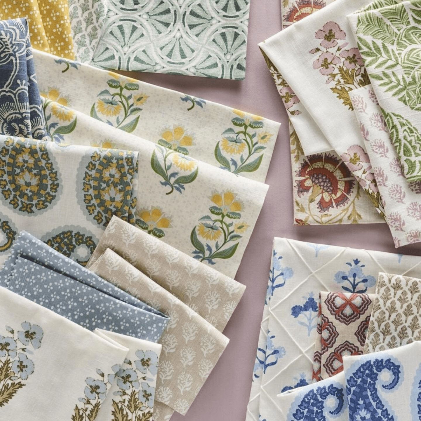 Assorted fabric swatches with floral and geometric patterns, various colors.