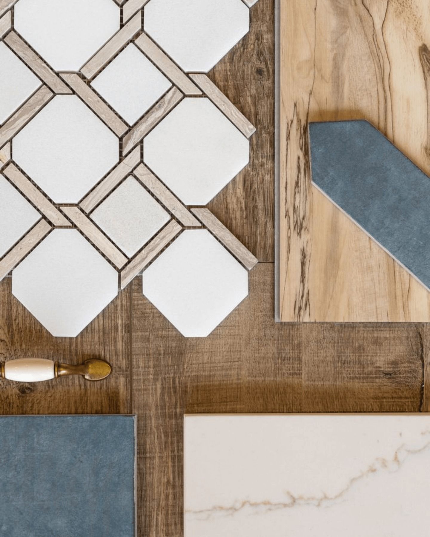 Samples of flooring and tile: patterned white tile, wood-look, blue tile, and white with beige veining.