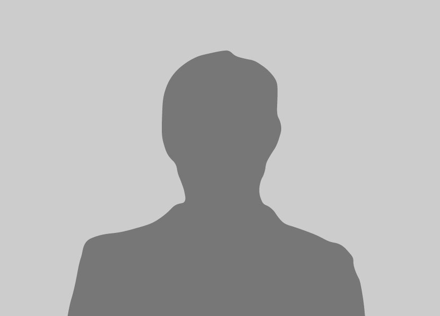 Silhouette of a person wearing a blazer, against a light gray background.