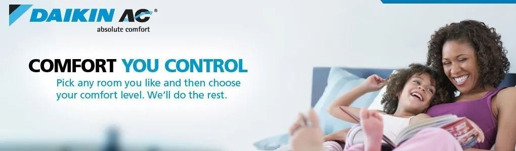 Mother and child smiling while lying on a bed. Advertisement promoting comfort control.