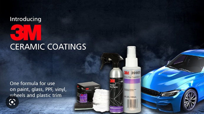 a blue car is sitting next to a bottle of 3m ceramic coatings.