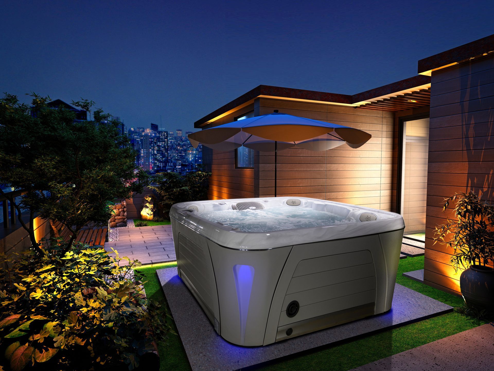 A hot tub is sitting on top of a lush green lawn under an umbrella.