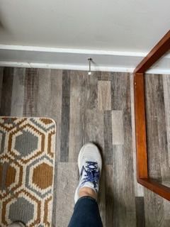 foot on a wooden floor