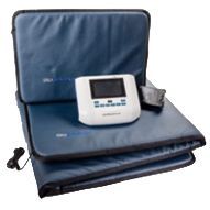 A flexpulse device is sitting next to a black case.