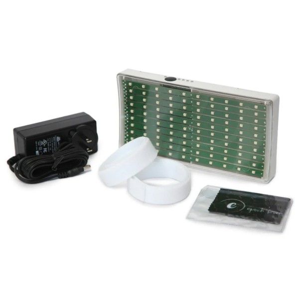 Green LED display kit with power adapter, two white discs, and a remote control on a white background