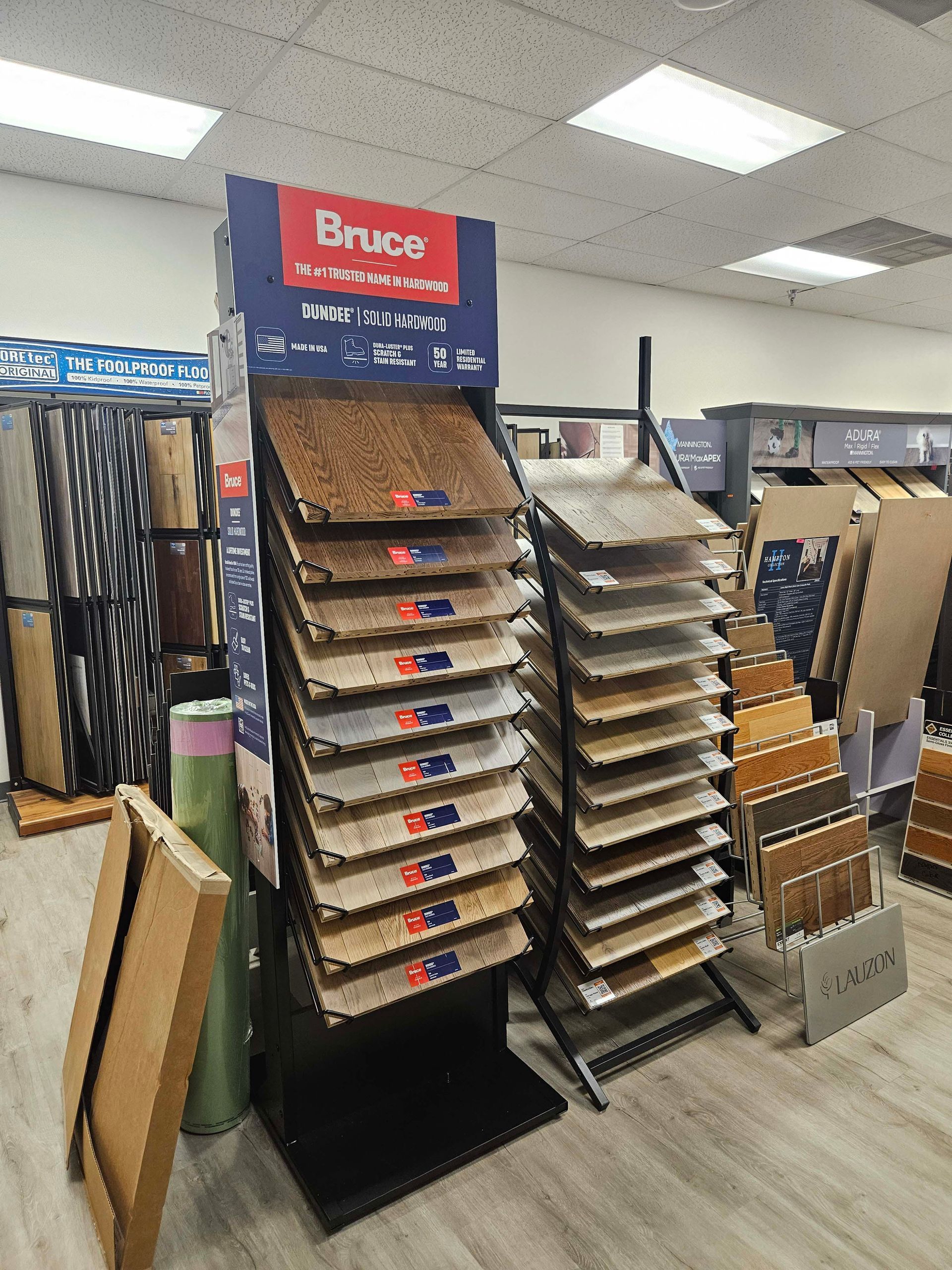 a display of carpets in a store with a sign that says brace