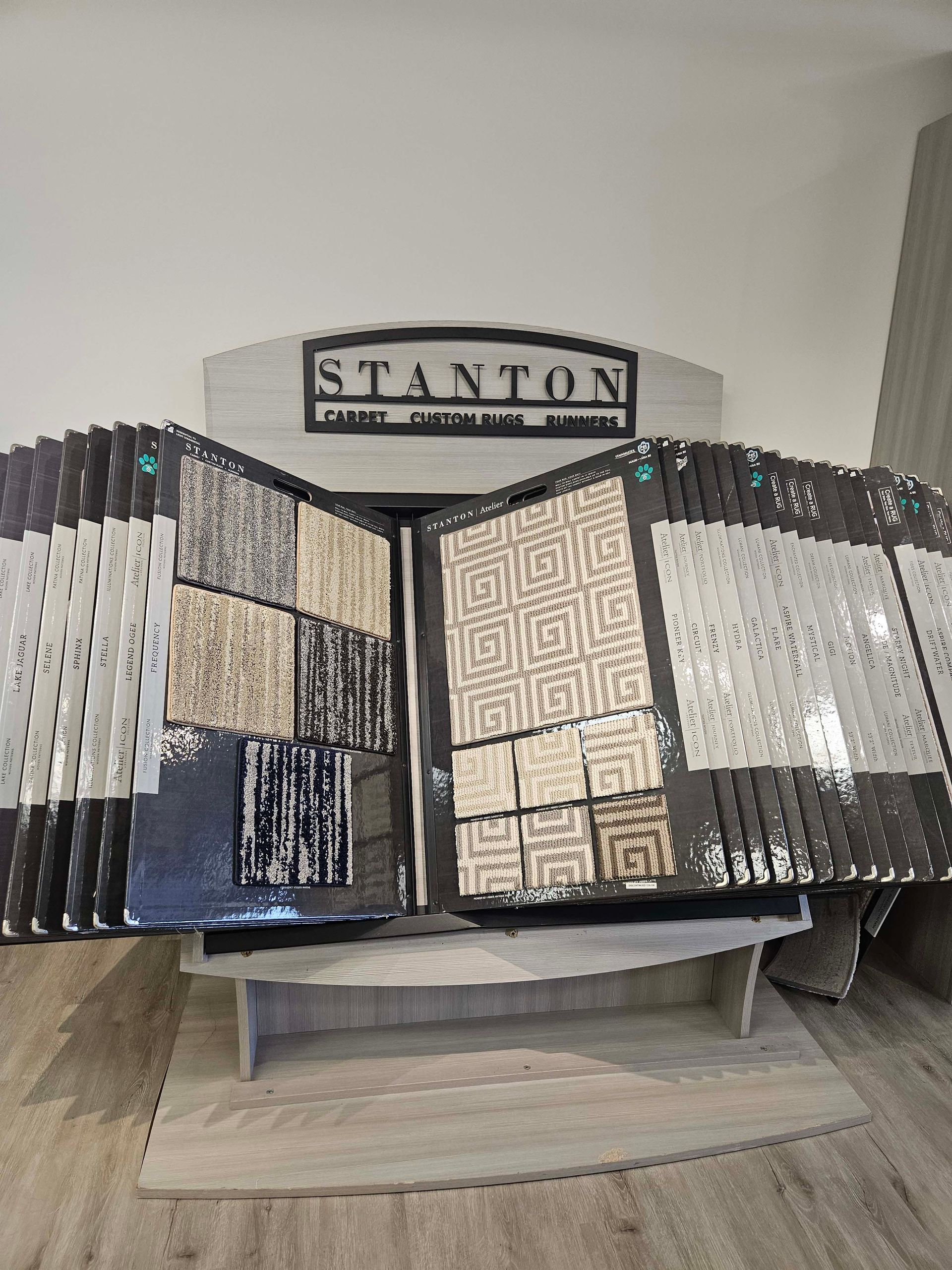 a display of tiles and carpets in a store .