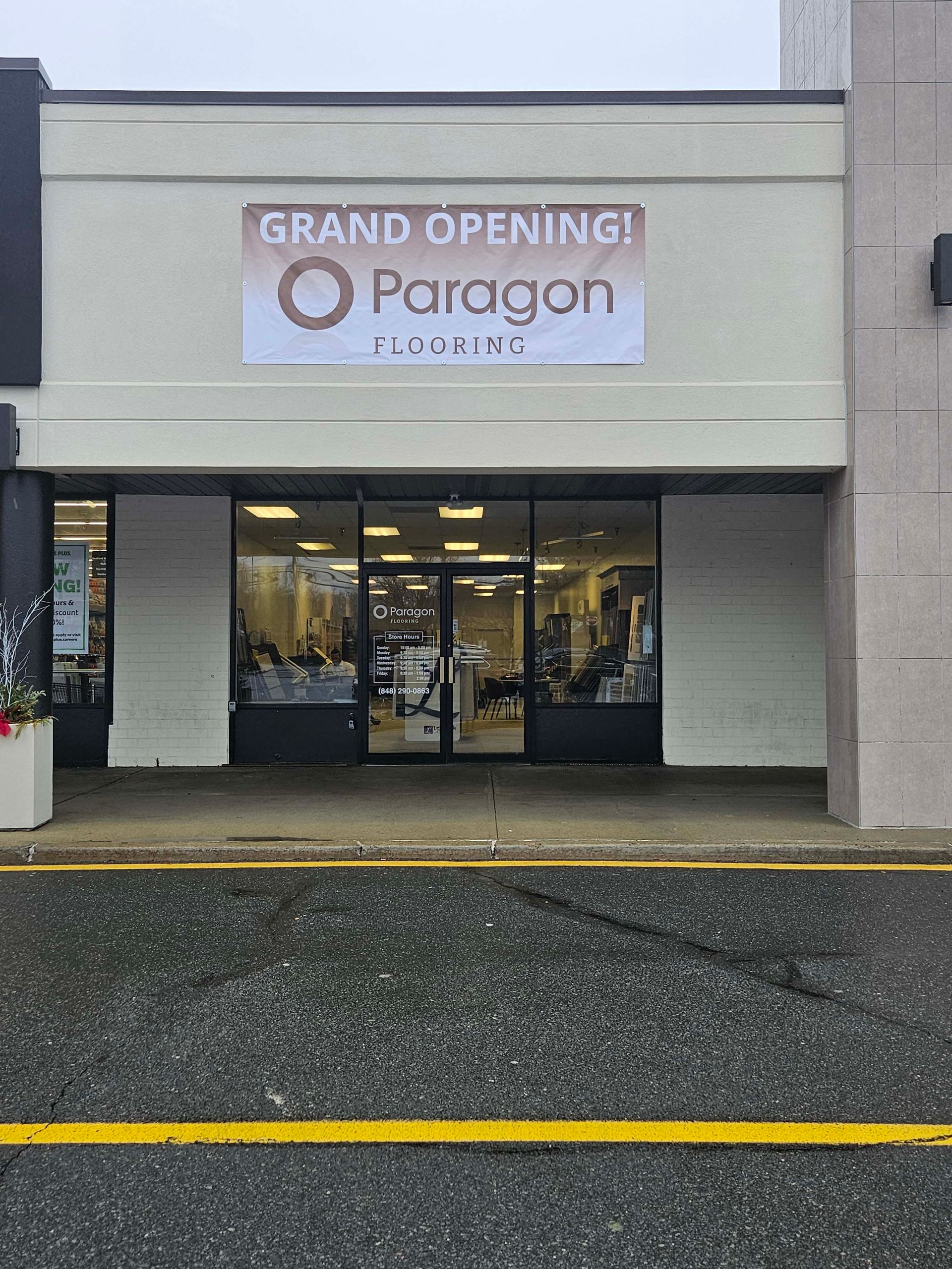 a store front with a sign that says `` grand opening paragon ''