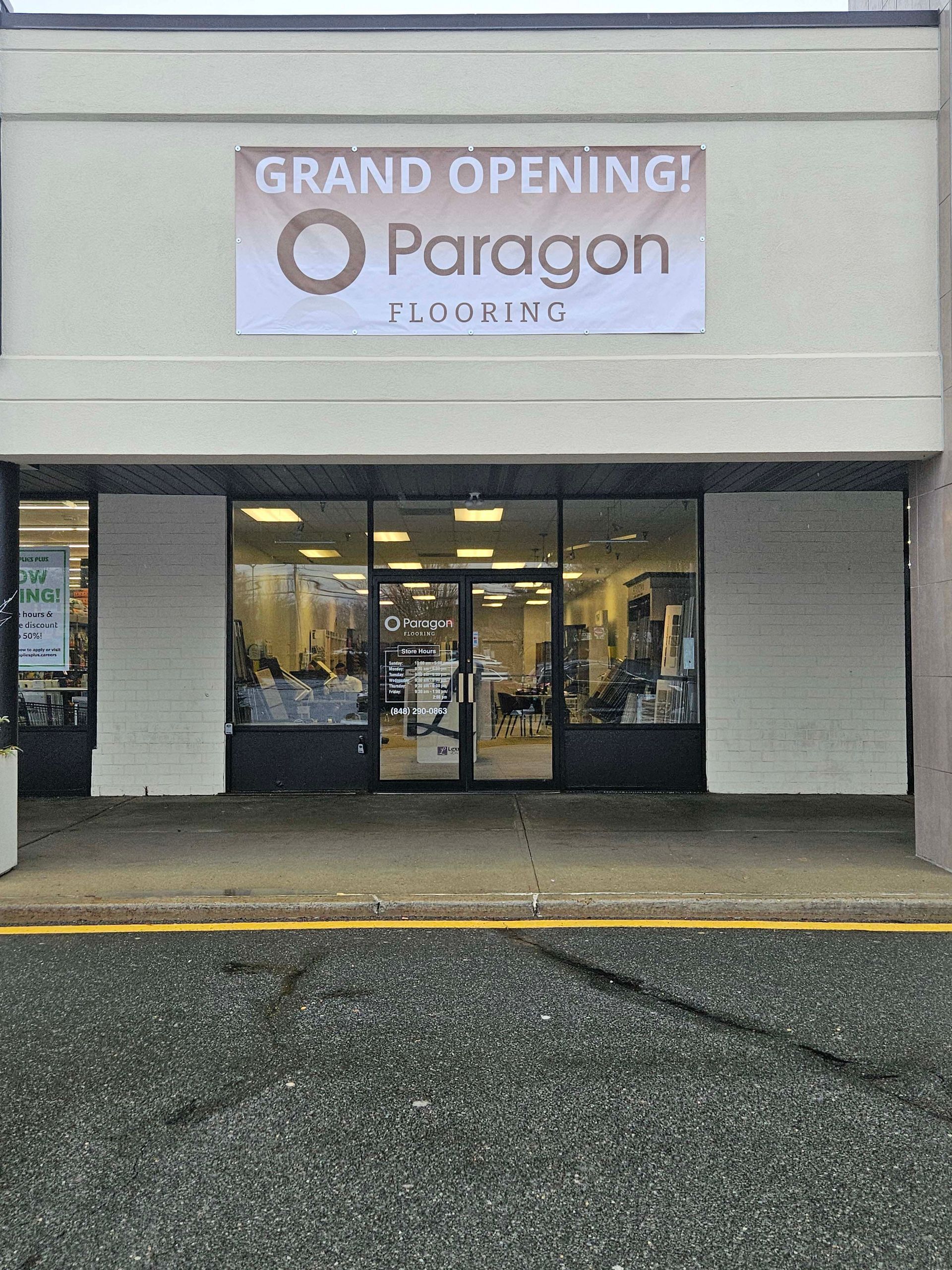 a store front with a sign that says `` grand opening ! ''