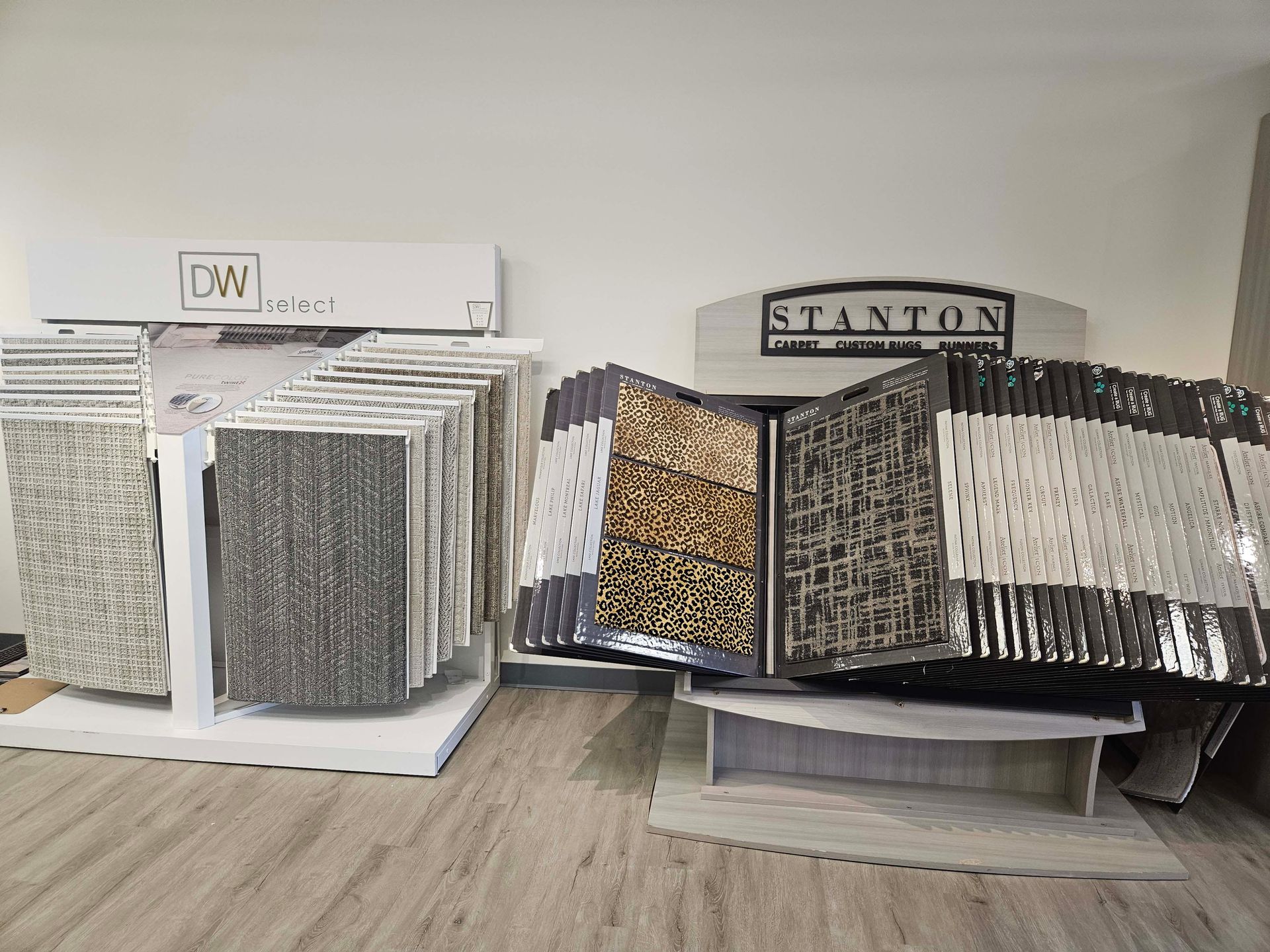 a display of tiles and carpets in a store .