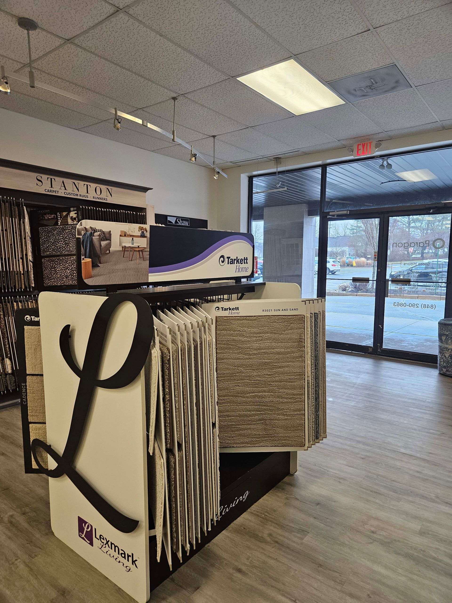 a carpet display in a store with a large letter l on it .