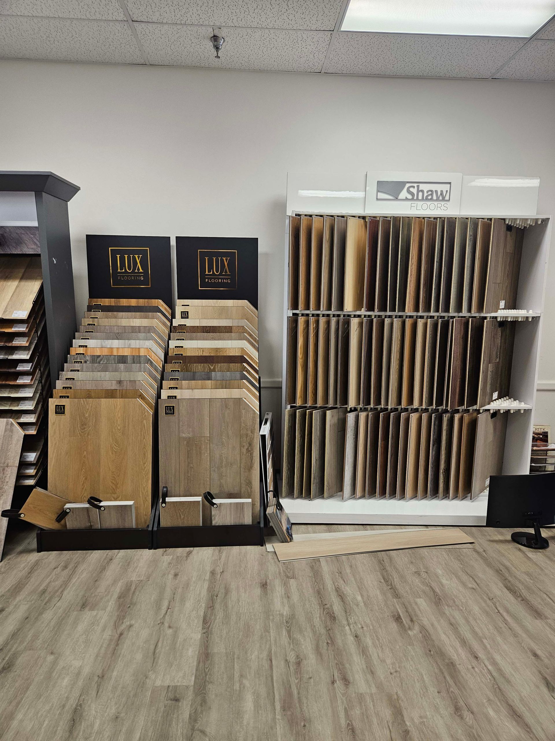 a showroom filled with lots of different types of flooring .