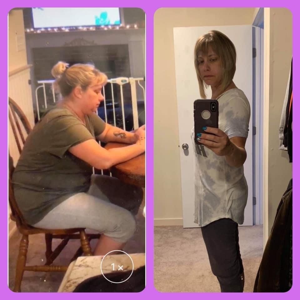 A woman is sitting at a table and taking a picture of herself