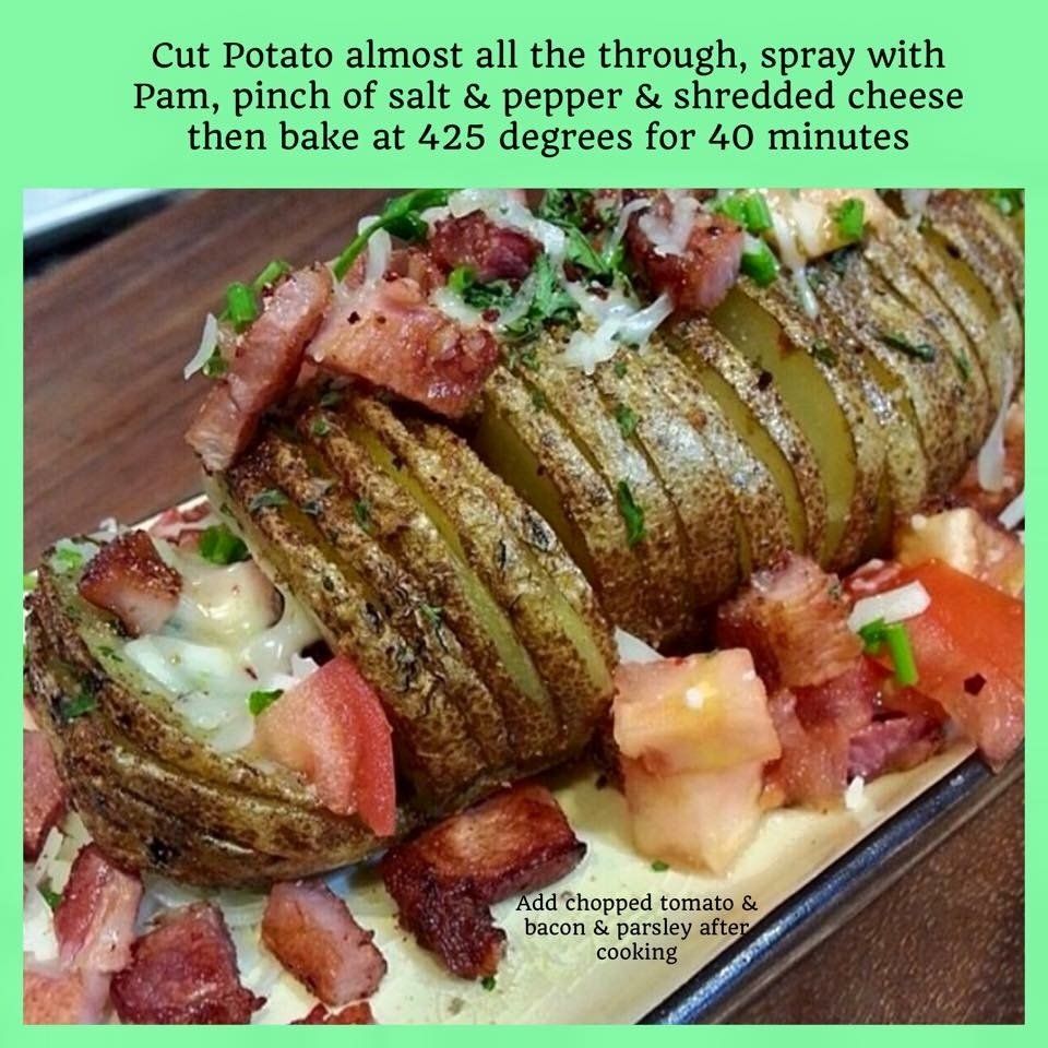 A close up of a potato with tomatoes and bacon on a plate