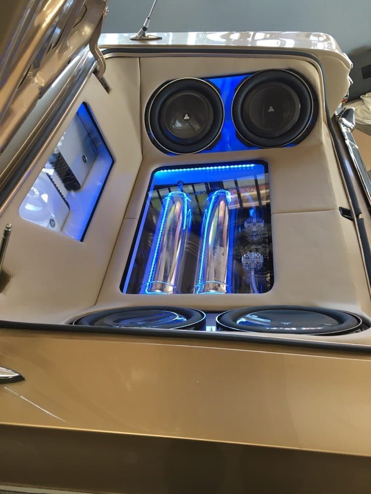 JL Audio in truck with purple lights