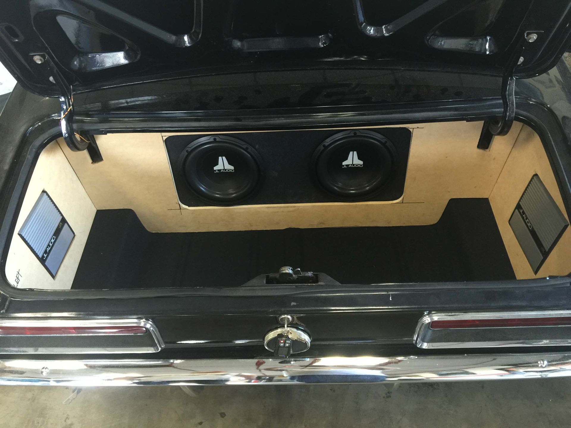 JL Audio installed in a trunk