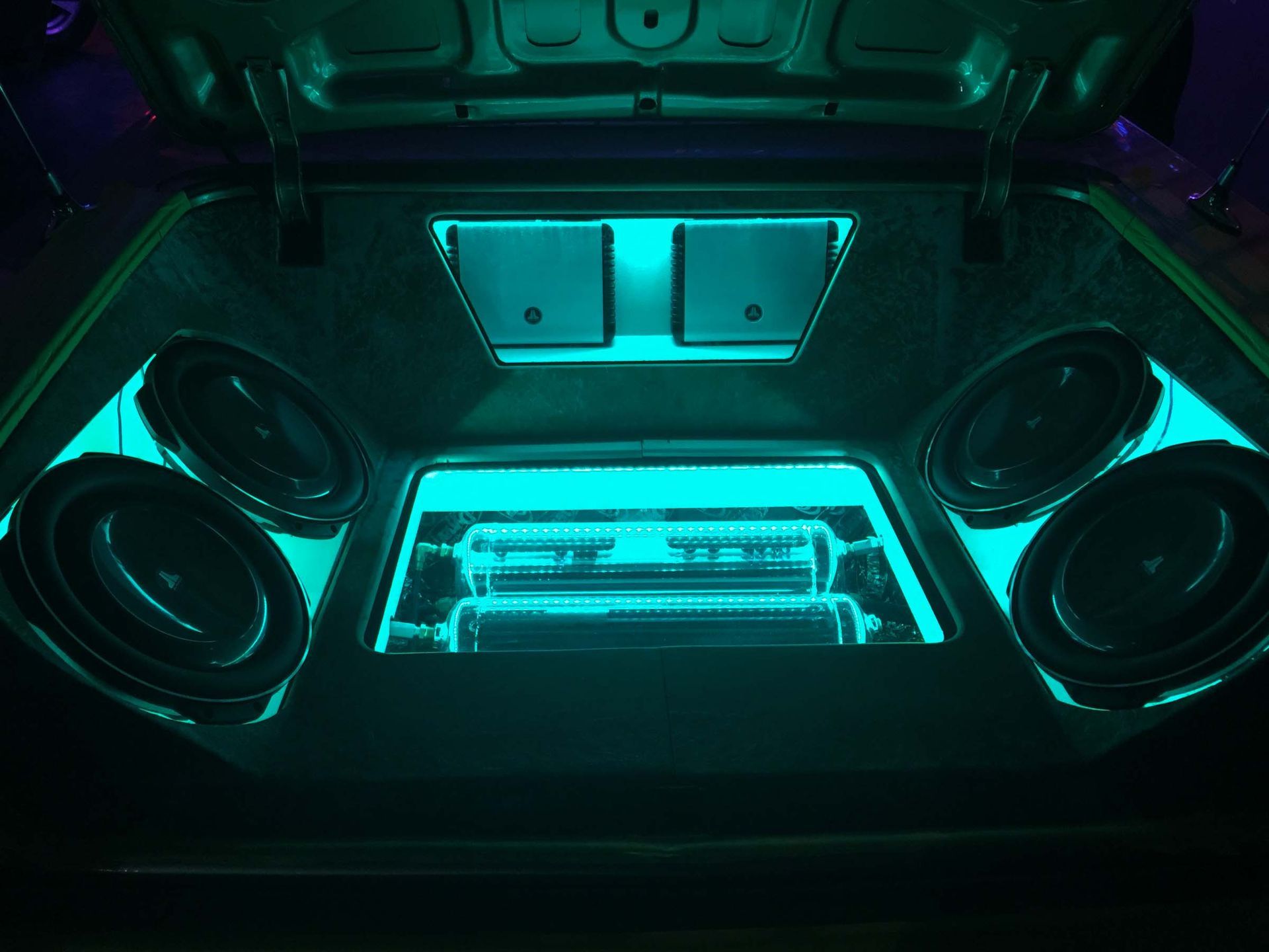 Car trunk with stereo and teal lights