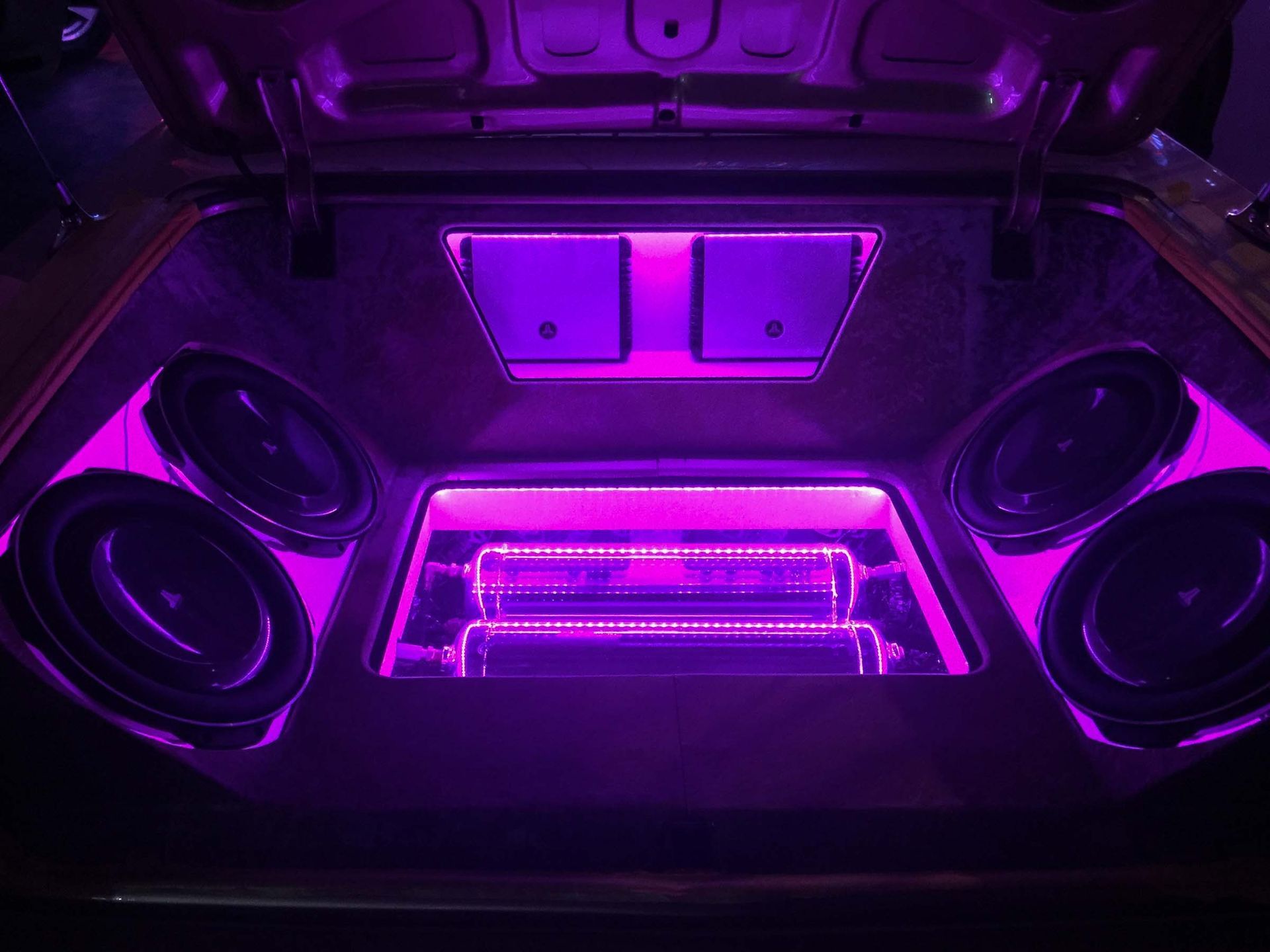 Car trunk with stereo and purple lights