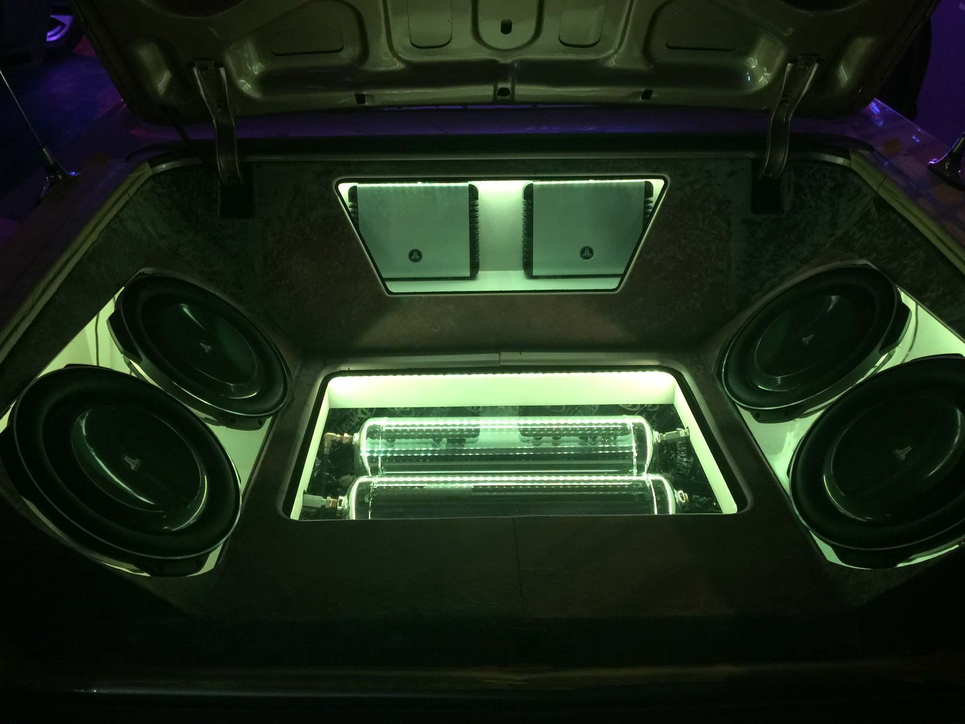 Car trunk with stereo and green lights