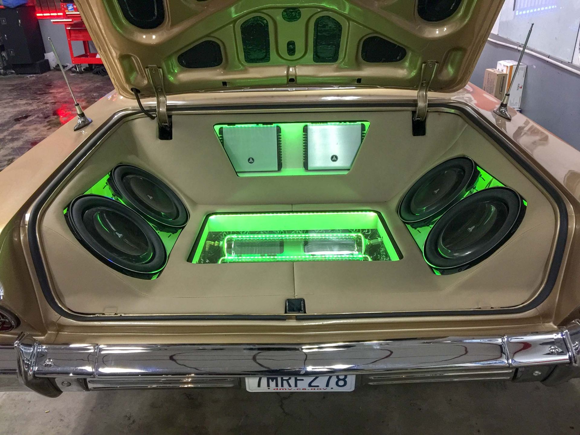 Car trunk with stereo and green lights