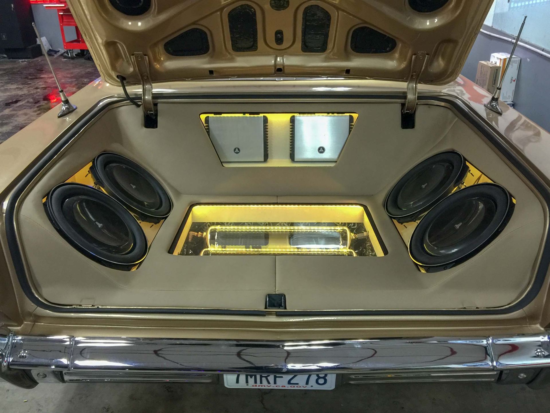 Car trunk with stereo and yellow lights