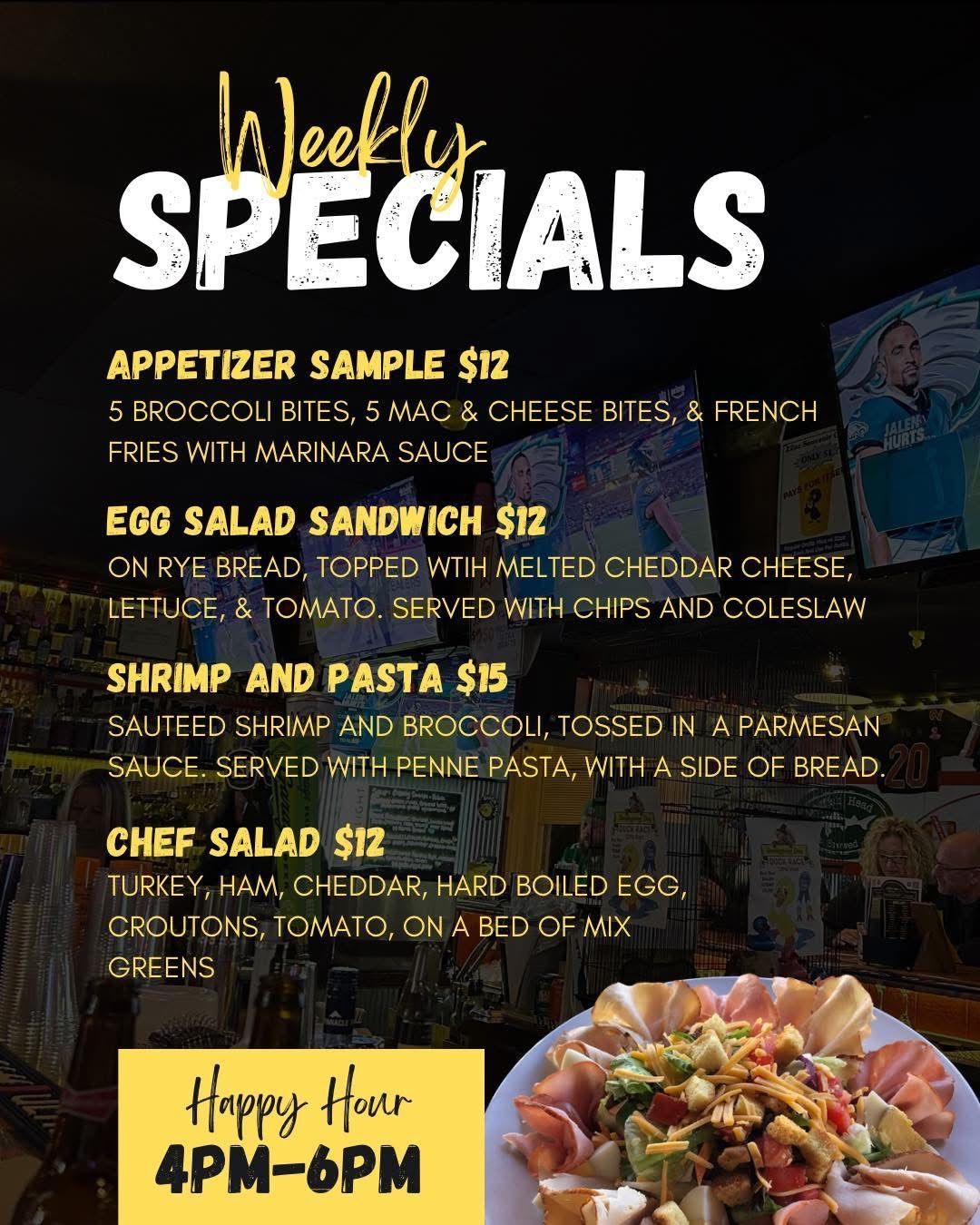 A weekly specials menu for a restaurant with a taco salad and pulled pork tacos.