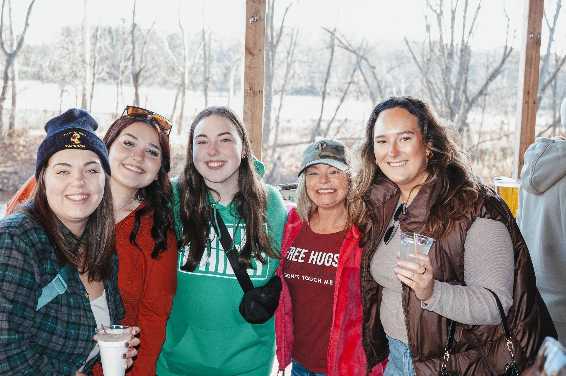 A group of young women are posing for a picture together.
