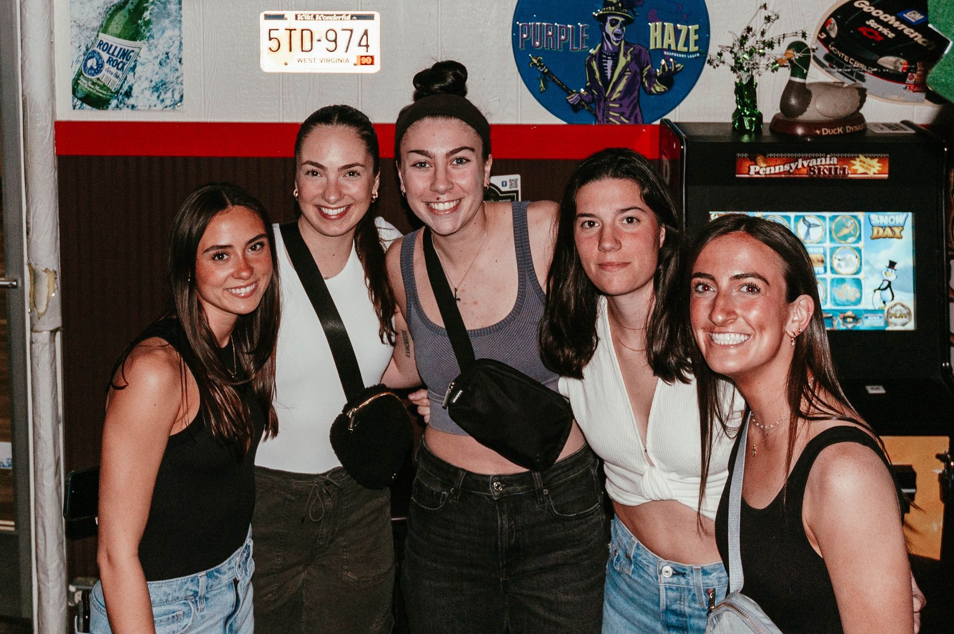 A group of young women are posing for a picture together.