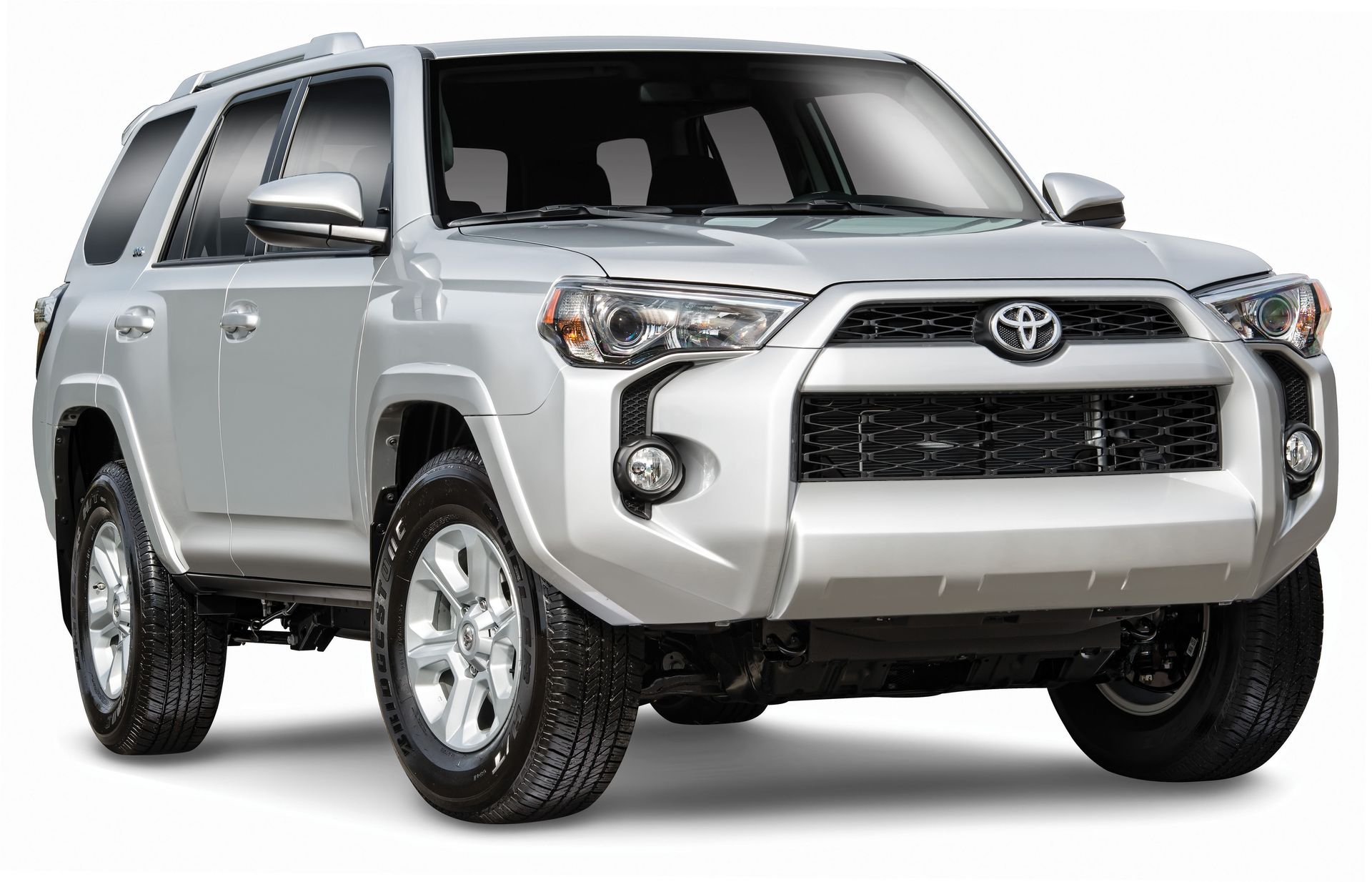 Silver Toyota SUV on a white background, angled front view with off-road styling