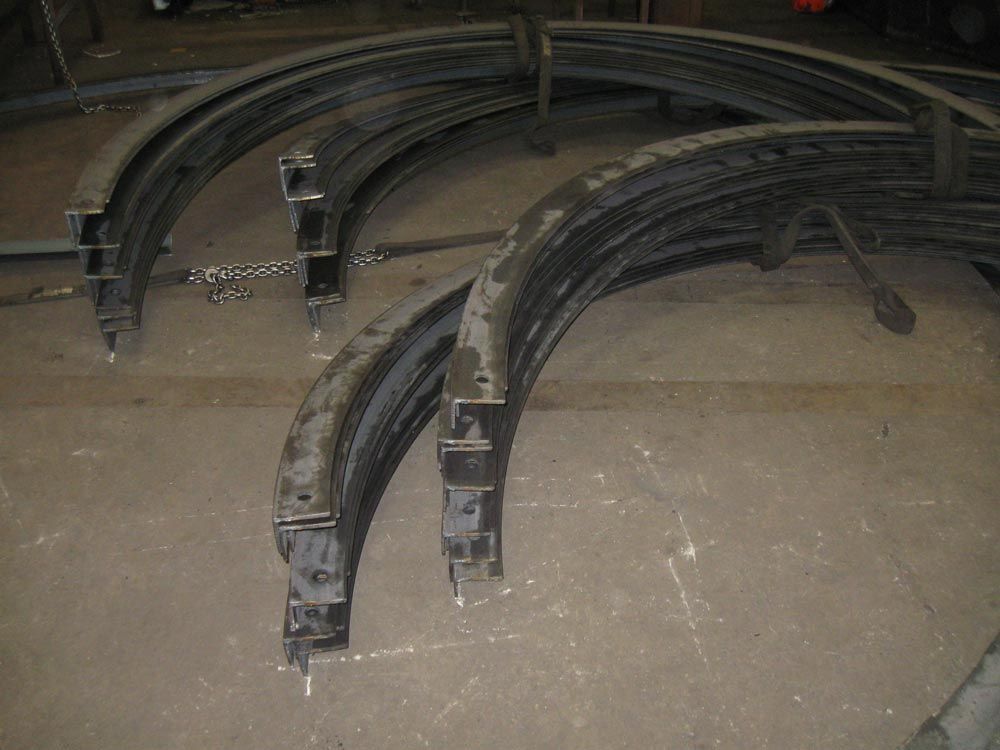 A bunch of metal pieces are sitting on a table.